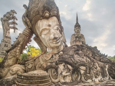 Reclining Buddha in Buddha Park Sala Kaew Ku ne clipart