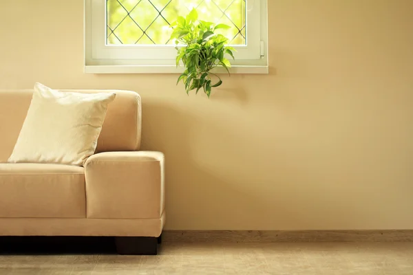 Sofa under window — Stock Photo, Image