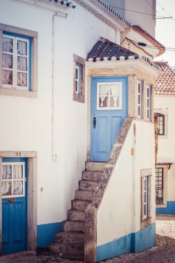 blue and white colored house in portugal clipart