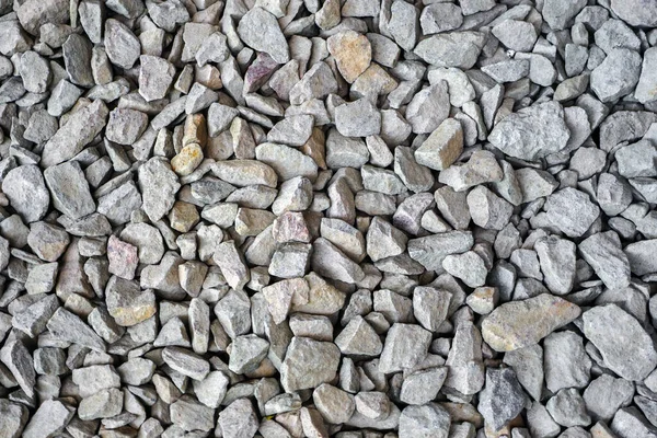 Crushed rock close up. Small rocks ground. Small stone construction material. Crushed stones building. Garden gravel background stone landscaping. Closeup Gravel road. Building material gravel texture Royalty Free Stock Images
