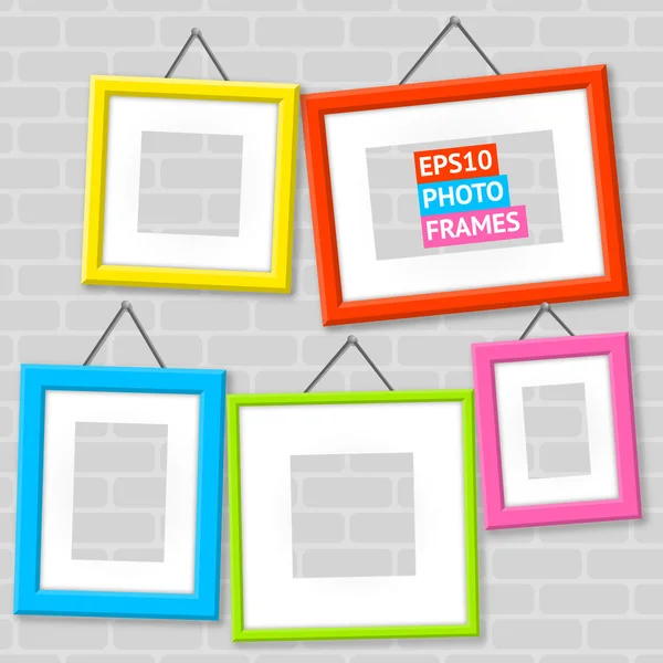 Set Of Photo Frames On A Wall — Stock Vector