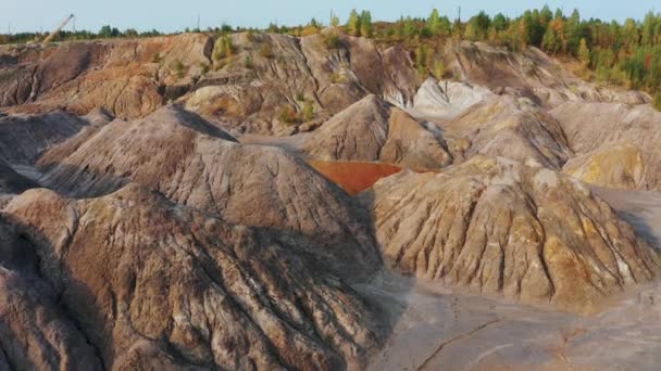 Aerial view of a landscape similar to the planet Mars with red hills and rivers with red water — Stock Video