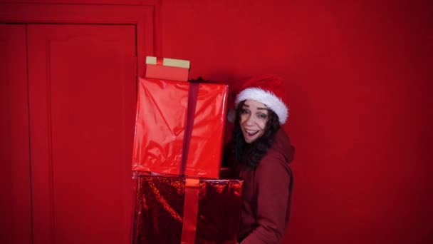 Young Woman Santa Claus Hat Holds Big Gifts Standing Red — Stock Video