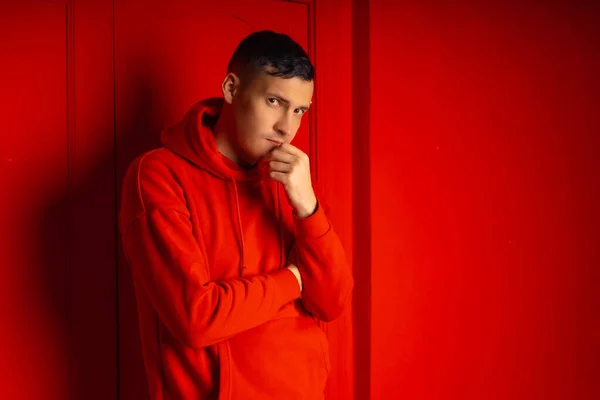 Young Handsome Man Posing Red Wall Attractive Male Red Hoodie — Stock Photo, Image