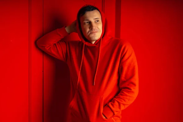 Young Handsome Man Posing Red Wall Attractive Male Red Hoodie — Stock Photo, Image
