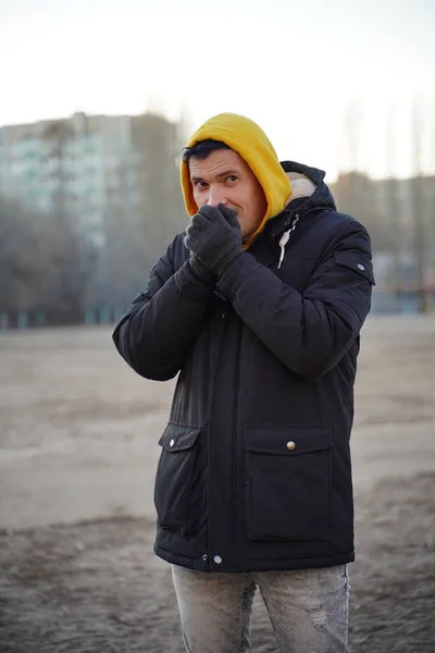 Young Frozen Man Yellow Hood Black Jacket Adult Male Warming — Stock Photo, Image