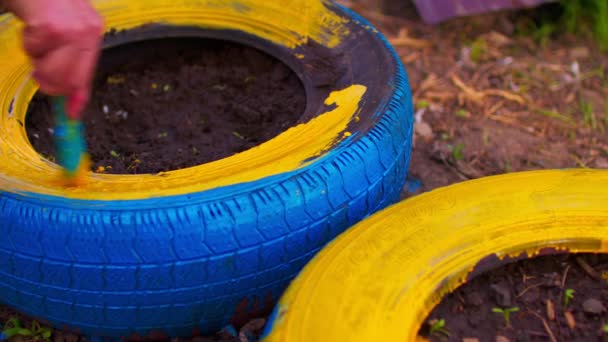 Close Unrecognizable Person Paints Wheel Yellow Paint Street Concept Renovation — Stock Video