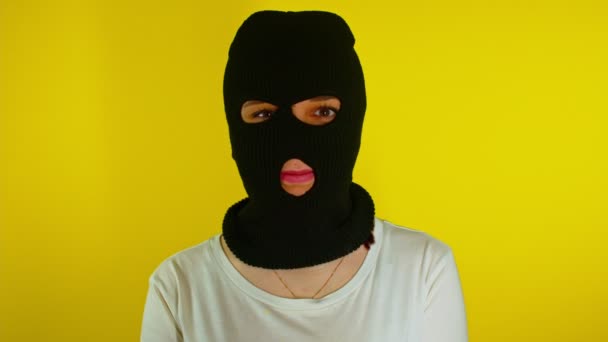 Close Unrecognizable Woman Black Balaclava Winks Yellow Background Unknown Female — Stock Video