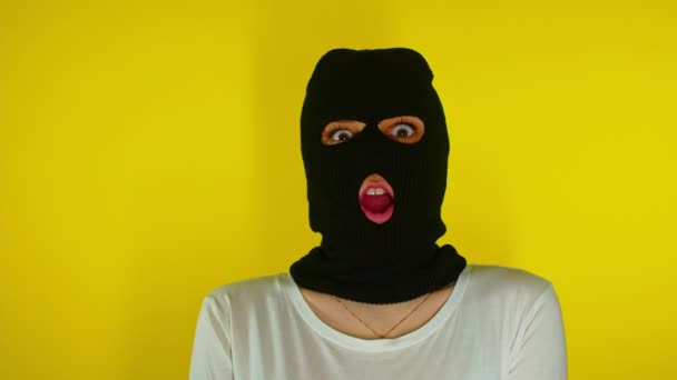 Close Unrecognizable Woman Black Balaclava Opens Her Mouth Surprise Yellow — Stock Video