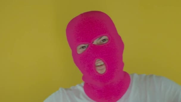Close Man Pink Balaclava Money Gun Yellow Background Unknown Guy — Stock Video
