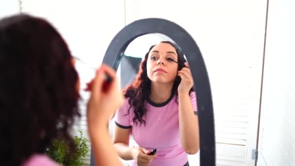 Young Beautiful Woman Pajamas Paints Her Eyelashes Mascara Looking Mirror — Stock Video