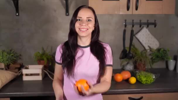 Pretty Young Woman Pajamas Tossing Orange Her Hands Portrait Charming — Stock Video