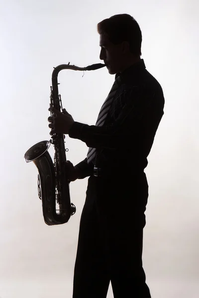 Saxophoniste D'homme Jouant Le Joueur De Saxophone Photo stock - Image du  ombre, isolement: 52189720