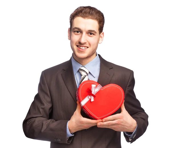 Biznesmen z prezent w kształcie serca — Zdjęcie stockowe