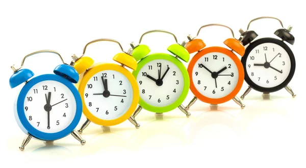 Colorful alarm clocks, align — Stock Photo, Image