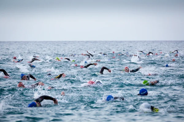 Calella, Spain, May 18. Triathletes in water in the the Ironman triathlon competition at Calella beach, May 18, 2014 in Calella, Spain — Stock Photo, Image
