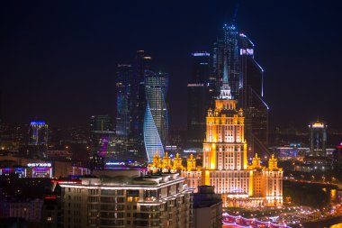 Moscow Business City and Stalin skyscraper building night aerial panorama