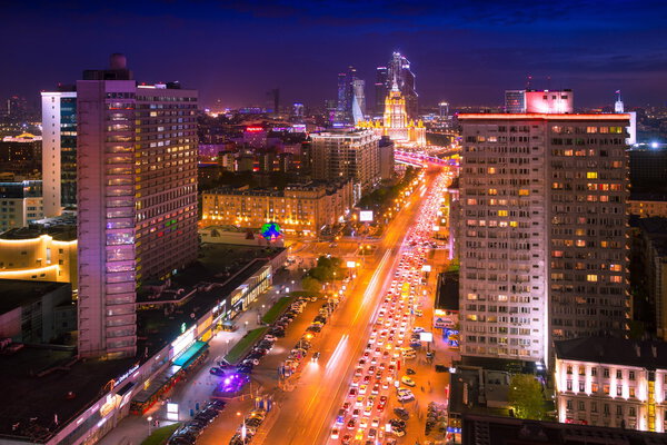 Noviy Arbat street, Moscow Business City and Stalin skyscraper building night aerial panorama