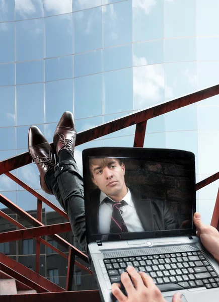 Businessman on screen of laptop