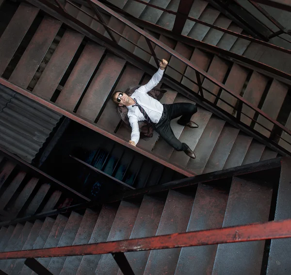 Lonely businessman on metal staircases — Stock Photo, Image