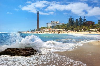 Beach and lighthouse of Maspalomas clipart