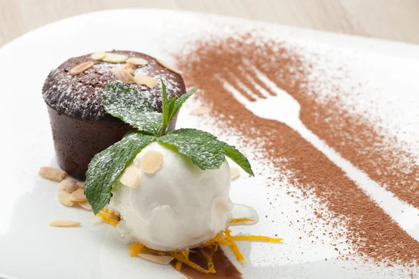 Warm chocolate cake Fondant with ice-cream ball, almond, mint, c — Stock Photo, Image