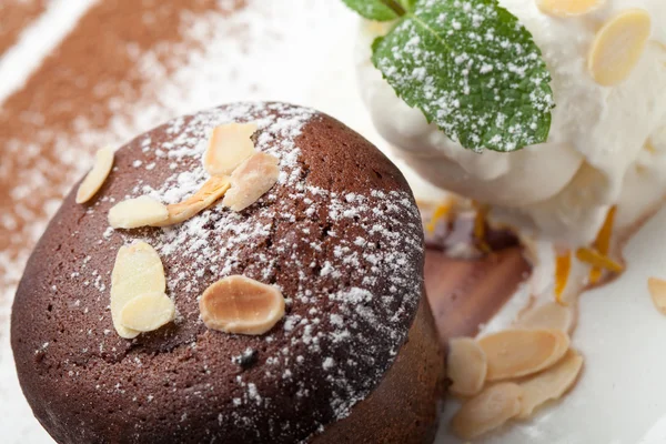 Warm chocolate cake Fondant with ice-cream ball, almond, mint, c — Stock Photo, Image