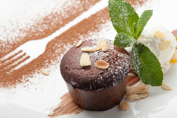 Warm chocolate cake Fondant with ice-cream ball, almond, mint, c — Stock Photo, Image