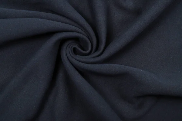 Πιέτες σε ύφασμα, πλεκτό υλικό σκούρου μπλε χρώματος, πτυχώσεις — Φωτογραφία Αρχείου