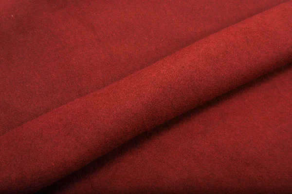Πιέτες σε ύφασμα, πλεκτό υλικό από κόκκινο χρώμα, πτυχώσεις — Φωτογραφία Αρχείου