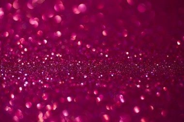 Pembe parlak bir arka plan. Kırmızı ve pembe arka plan ışıl ışıl parıldıyor..
