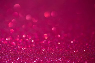 Pembe parlak bir arka plan. Kırmızı ve pembe arka plan ışıl ışıl parıldıyor..