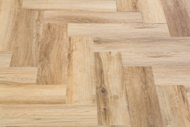 Ringa kemiğinden arkaplan ve parke. Ahşap döşeme, iç dekorasyonun oturma odasında bir sembol deseni var.