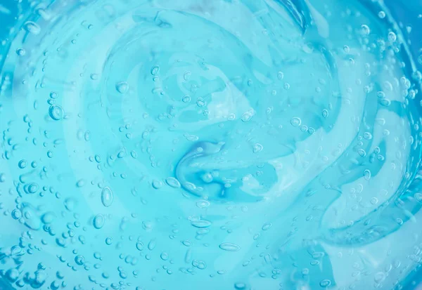 Fundo de gel cosmético. Gel transparente azul com textura e bolhas de perto — Fotografia de Stock