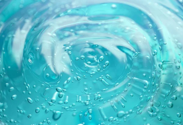 Sfondo gel cosmetico. Gel trasparente blu con texture e bolle da vicino — Foto Stock