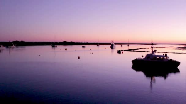 Dusk in Quatro-Aguas Recreational Port and ferry boat pier to Tavira island in Ria Formosa Natural Reserve. Algarve, Portugal. — Stock Video