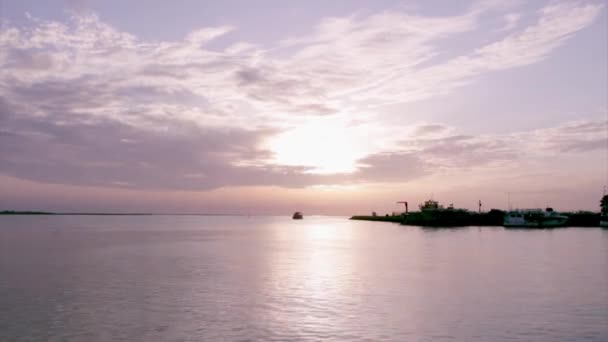 Sunset boat silhouette at Olhão, capital of Ria Formosa wetlands natural conservation region landscape, Algarve, southern Portugal. — Stok video