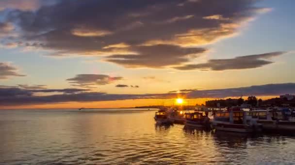 Sunset timelapse and boat silhouette at Olhão, capital of Ria Formosa wetlands natural conservation region landscape, Algarve, southern Portugal. — Stock video