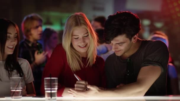 Girl flirting with guy at bar ⬇ Video by © iD-Stock Stock Footage #113711558