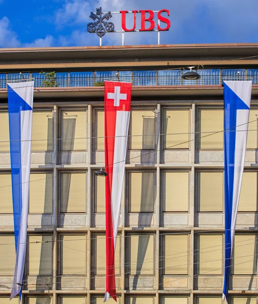 Facade of the UBS building decorated with flags — Stock Photo, Image