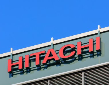 Hitachi sign on the wall of the office building clipart