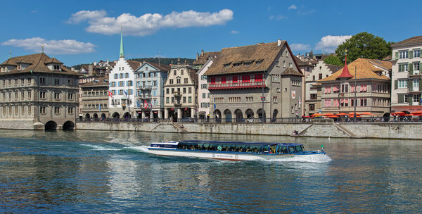 Zurich, Switzerland - 30 July, 2015: view on the Limmat river and the Limmatquai quay with the 