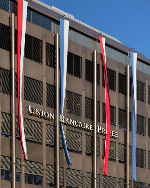 UBP building facade decorated with flags