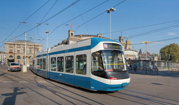 Tram passing the Bahnhofbruecke bridge — ストック写真