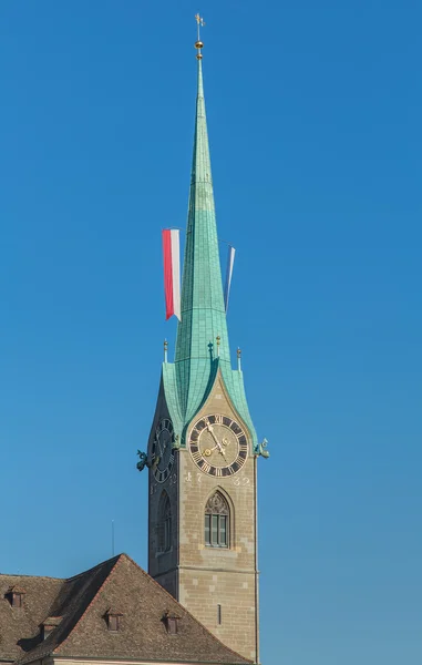 Tower of the Fraumunster, decorated with flags — Stock Photo, Image