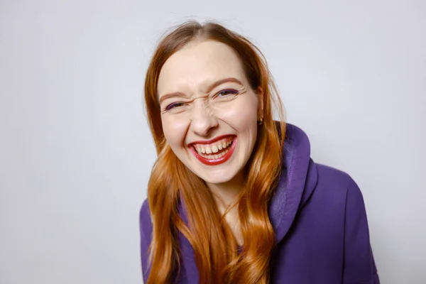 Laughing Redhead Girl Purple Hoodie Light Background — Stock Photo, Image