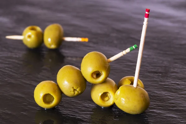 Olives with toothpicks — Stock Photo, Image