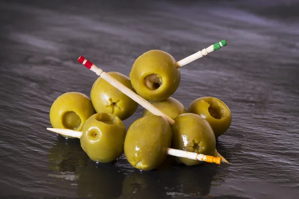 Olives with toothpicks — Stock Photo, Image