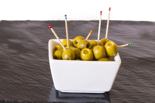 Olives with toothpicks — Stock Photo, Image