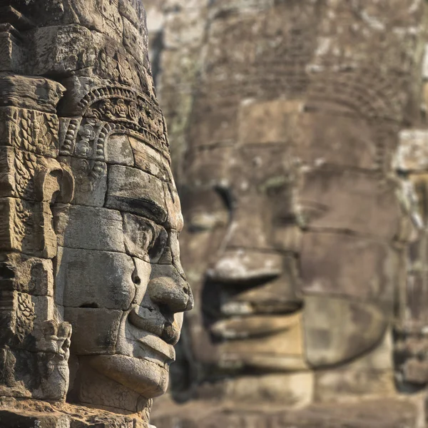 Ancient stone faces of king Jayavarman VII at The Bayon temple,